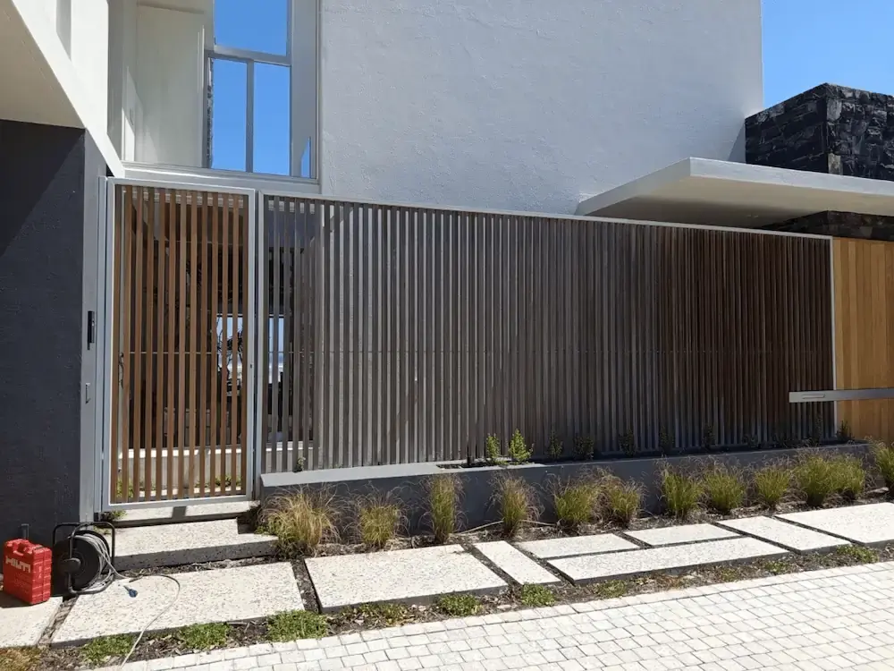 Contemporary steel security gate and fence system — Atlantic Seaboard, Clifton, Bantry Bay, Cape Town