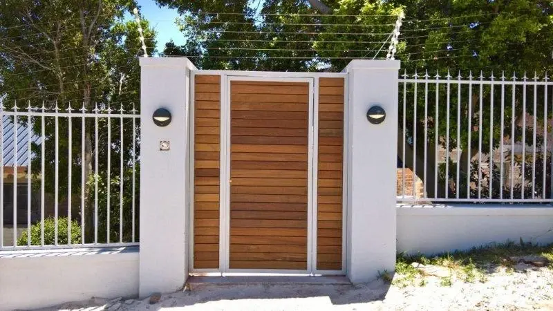 Custom galvanized mild steel driveway gate with IPE timber cladding, Cape Town