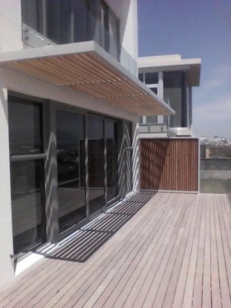 Steel and timber rooftop pergola with louvre screen on luxury Cape Town property